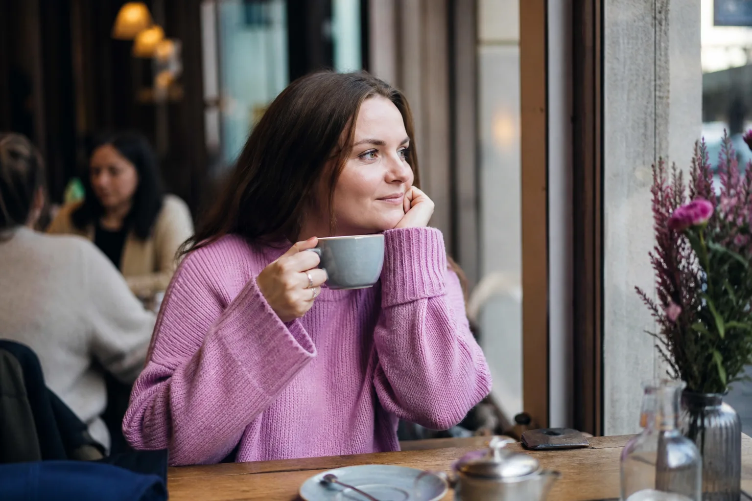 Two people talking over coffee in Aberdeen city centre